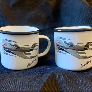 Two Breitling enamel mugs.